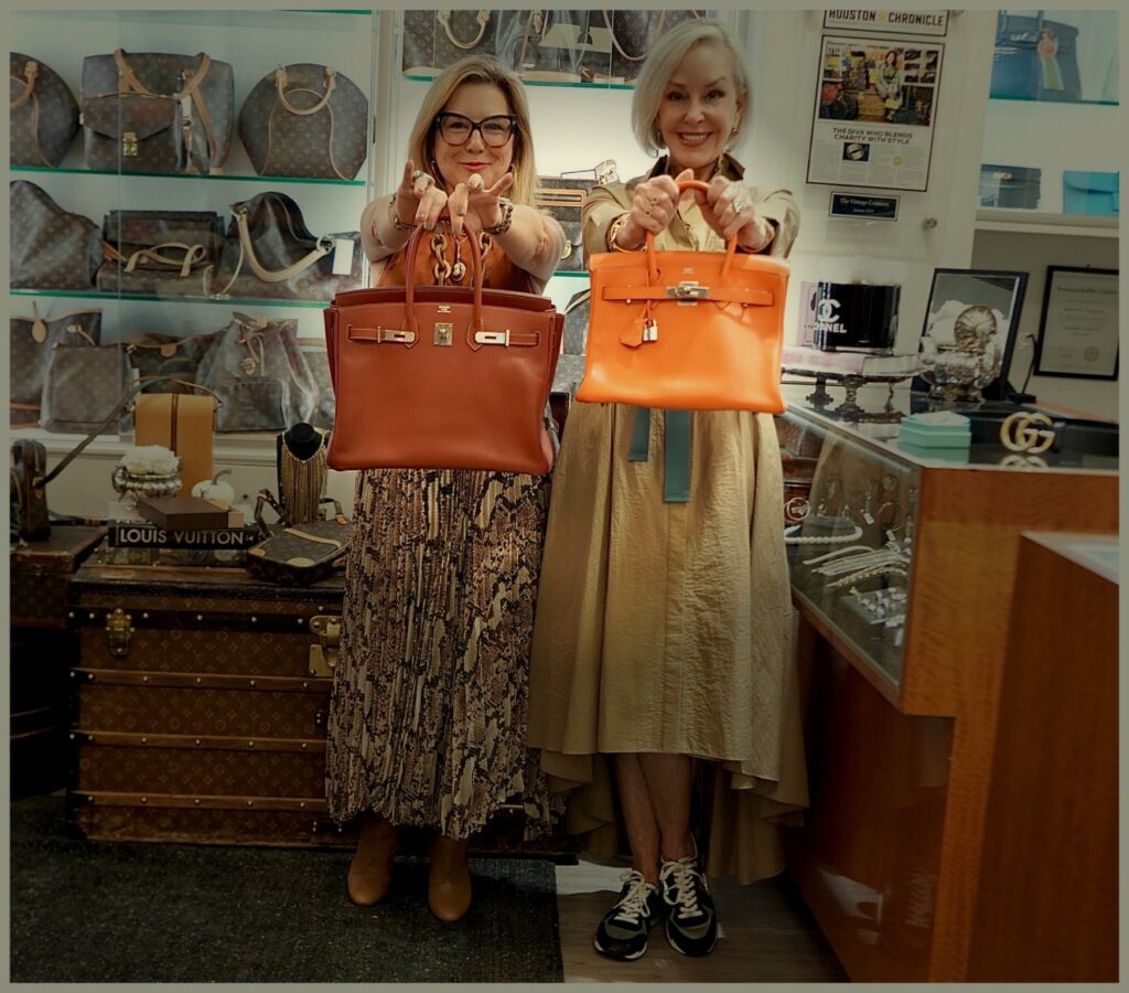 Sheree Frede and Donae Chromasta each holding out an Hermes Birken bag