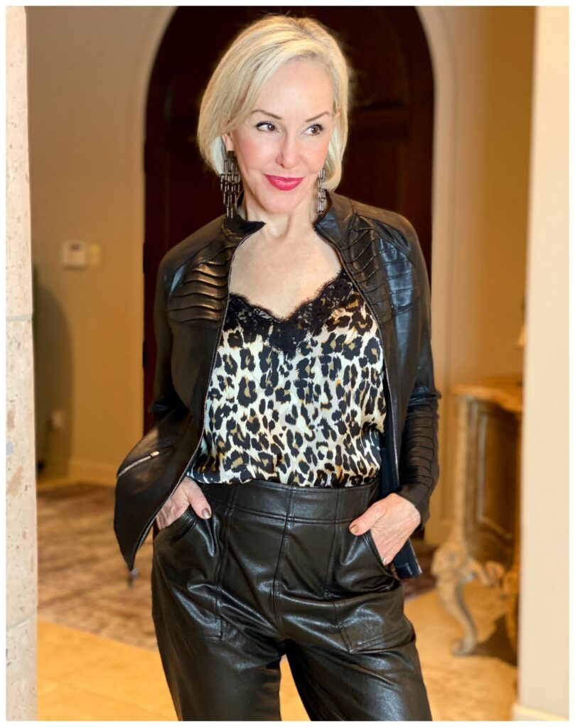 Sheree Frede of the SheShe Show wearing black zip faux leather jacket with leopard camisole