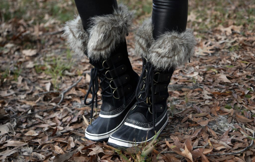 A photo of black Sorel boots with fur