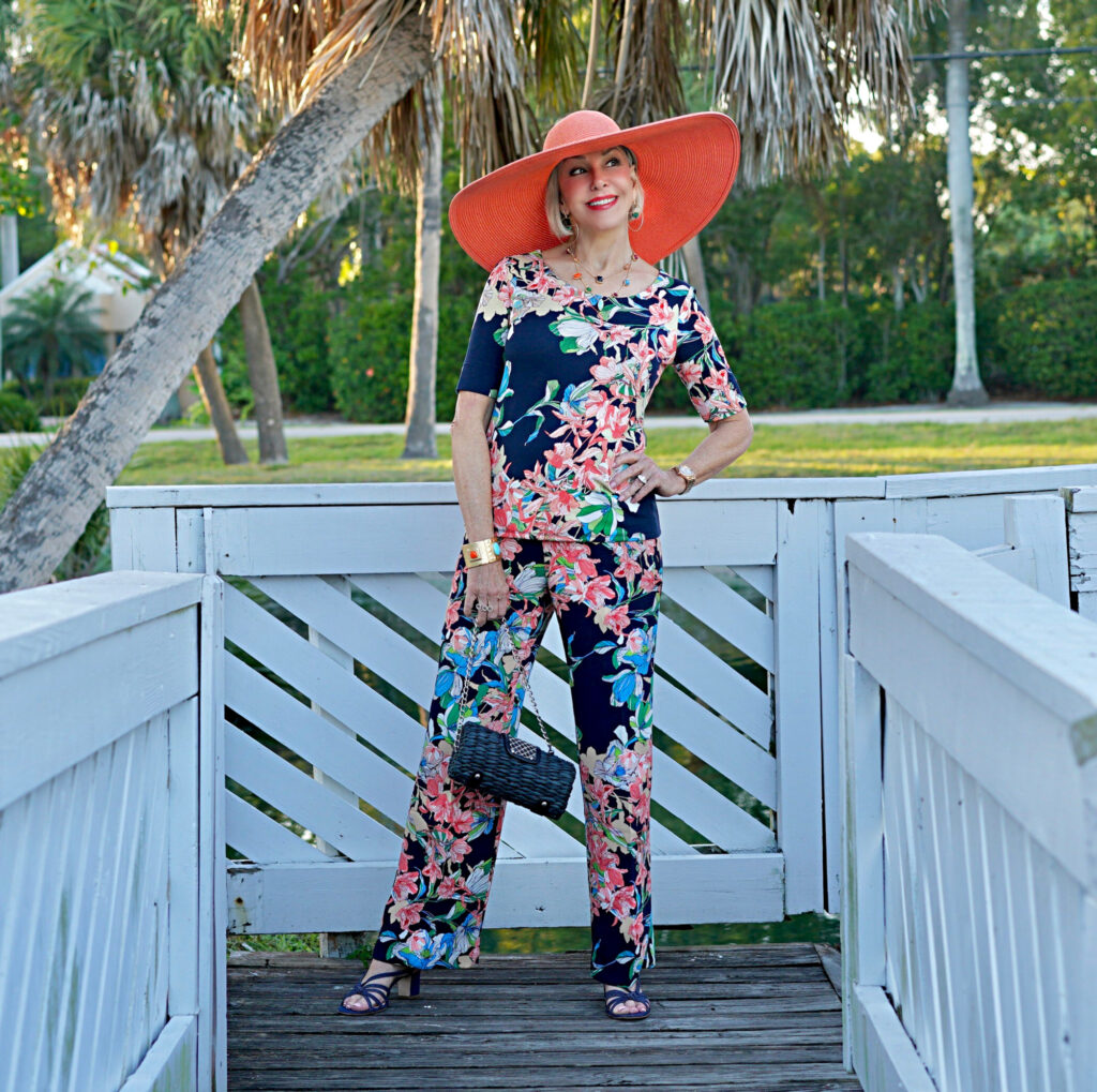 Sheree Frede of the SheShe Show wearing Chico's 2 piece floral wide leg pant and shirt set