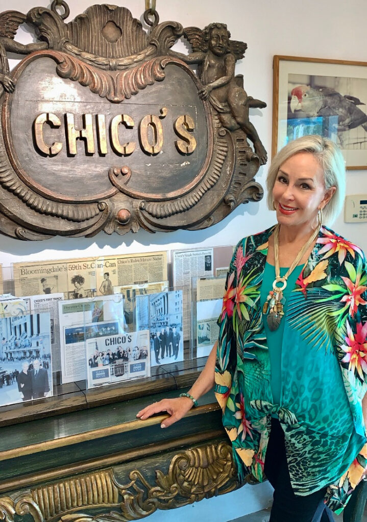 Sheree Frede of the SheShe Show standing in front of Chico's sign