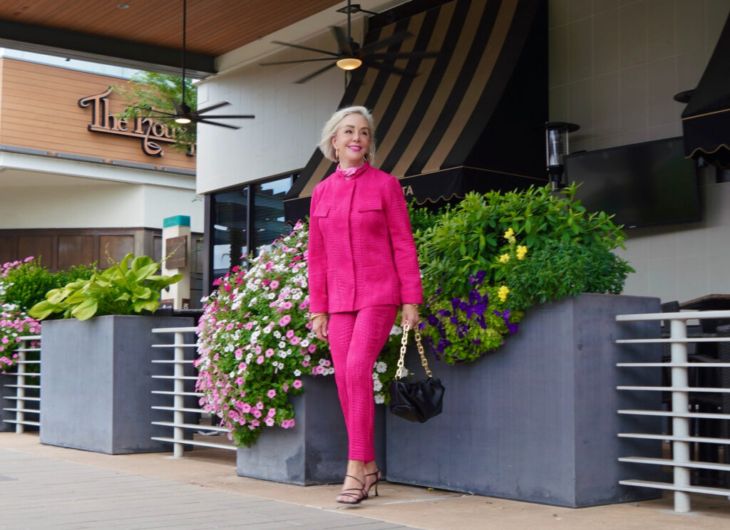 Sheree Frede of the SheShe Show wearing a hot pink pant suit