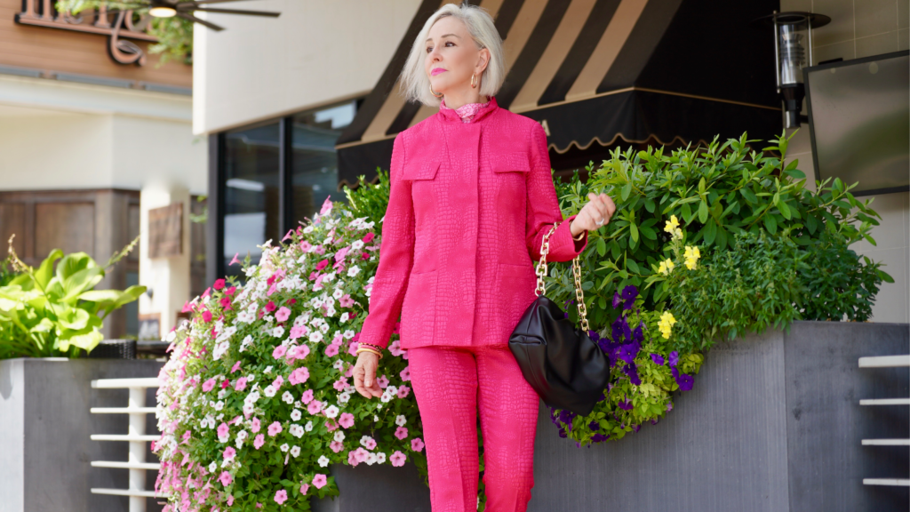 Sheree Frede of the SheShe Show wearing a hot pink pant suit