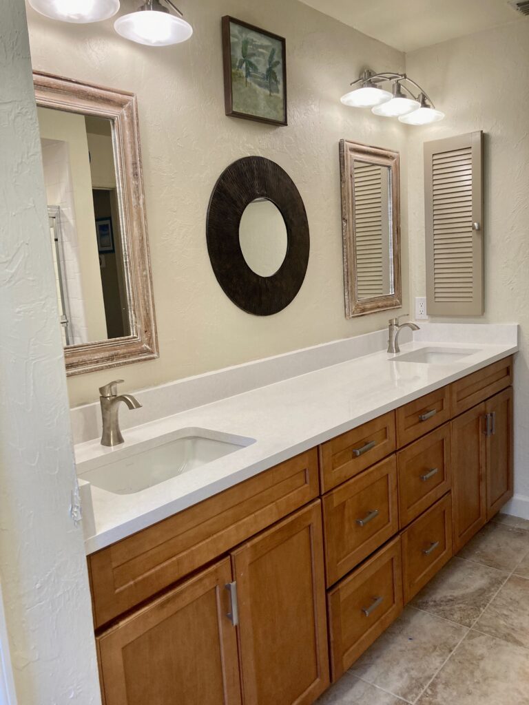 Bathroom update, teal cabinets, white quartz, mirrors