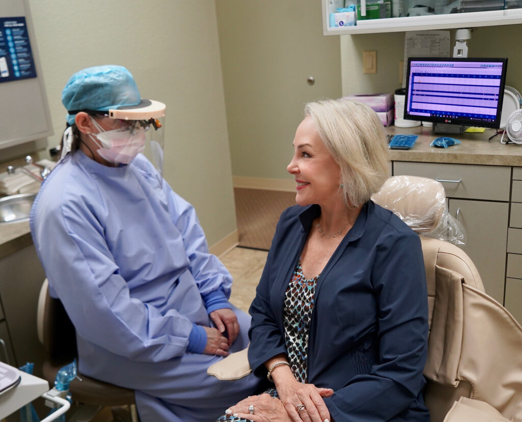 Sheree Frede of the SheShe Show in dental chair getting her teeth cleaned