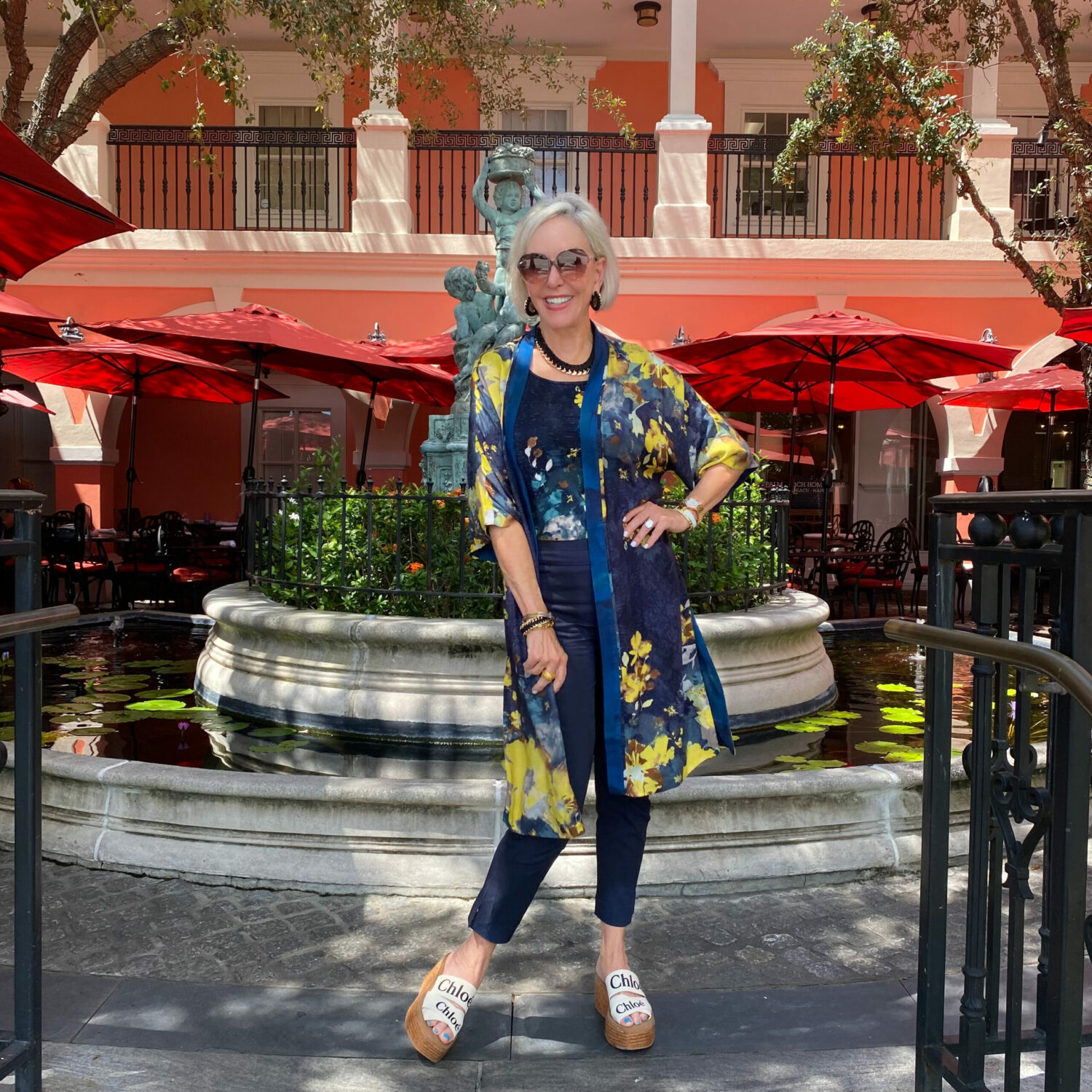 Sheree Frede in Chico's Floral ruana wrap and navy Brigette pant