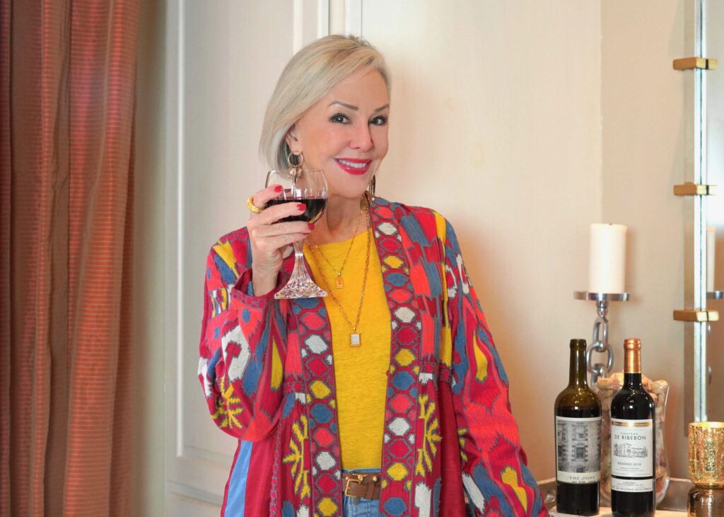 Sheree Frede holding WTSO red wine in wine glass