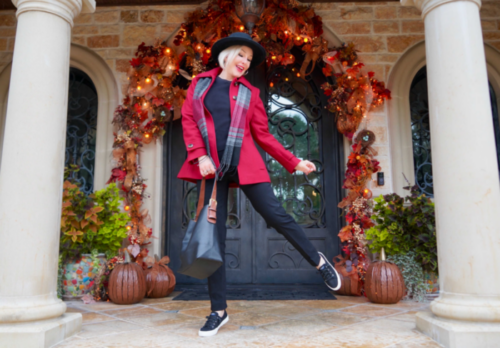 Sheree frede wearing a red short coat and black pants