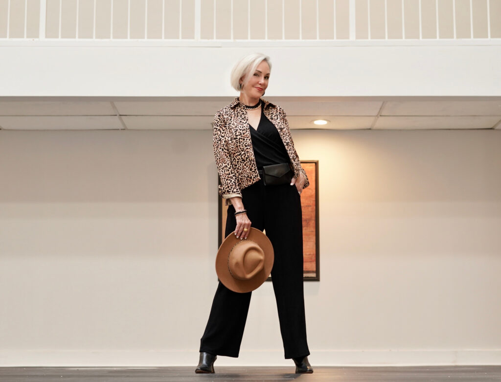 Sheree Frede of the SheShe Show wearing a Chico's black jumpsuit and leopard print jacket