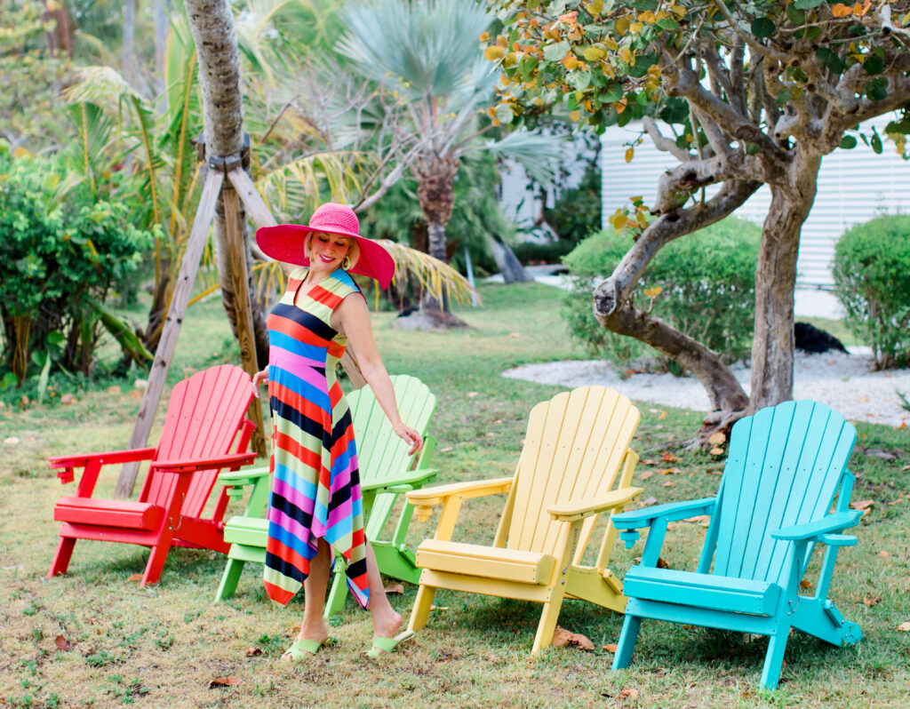 Sheree Frede of the SheShe Show wearing a Coldesina stripe midi dress with big pink hat