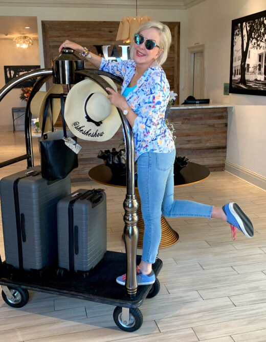 Sheree on luggage cart with traveling for travel