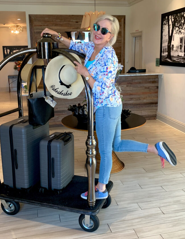 Sheree on luggage cart with traveling for travel