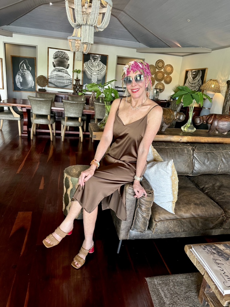 Sheree wearing a bronze colored satin slipdress with scarf head wrap