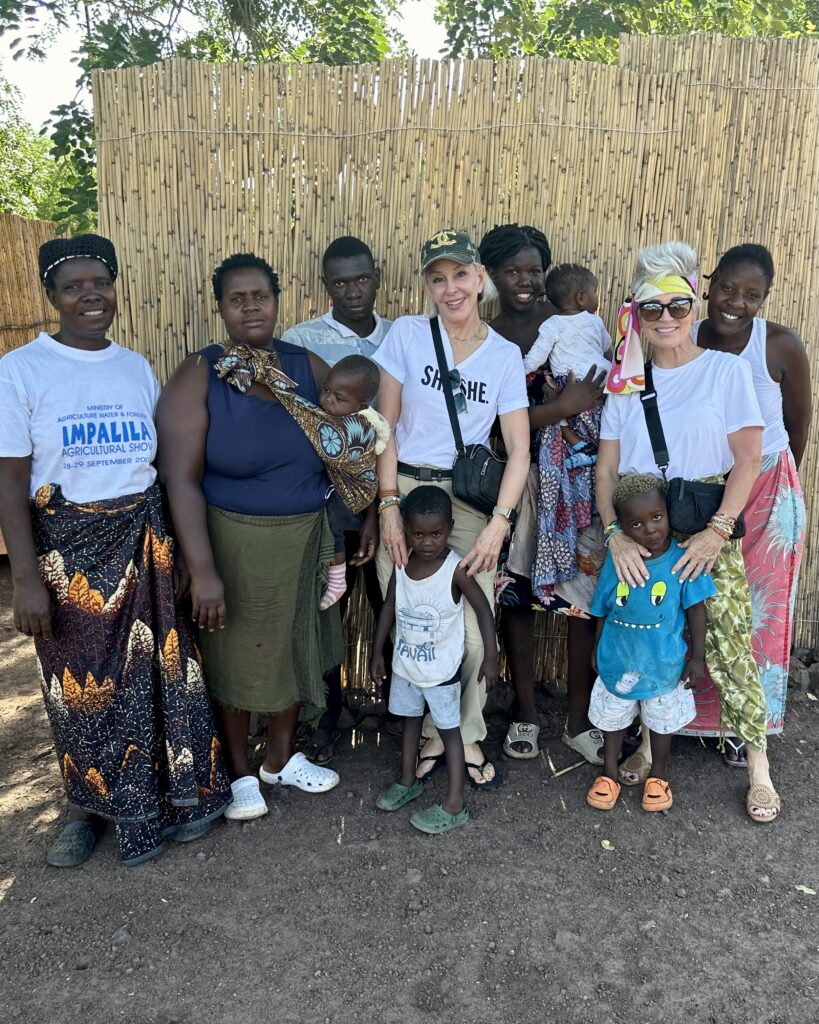 MPALILA ISLAND (NAMIBIA) Sheree & Shauna with village ladies and children