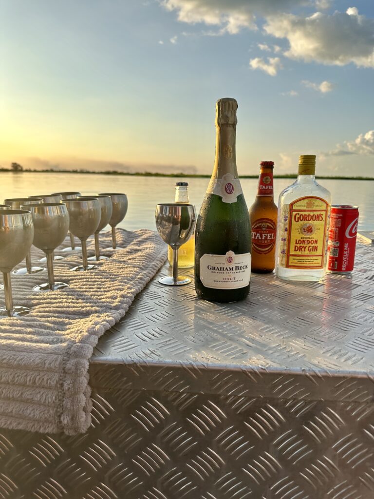 Sunset, champagne on boat in Africa