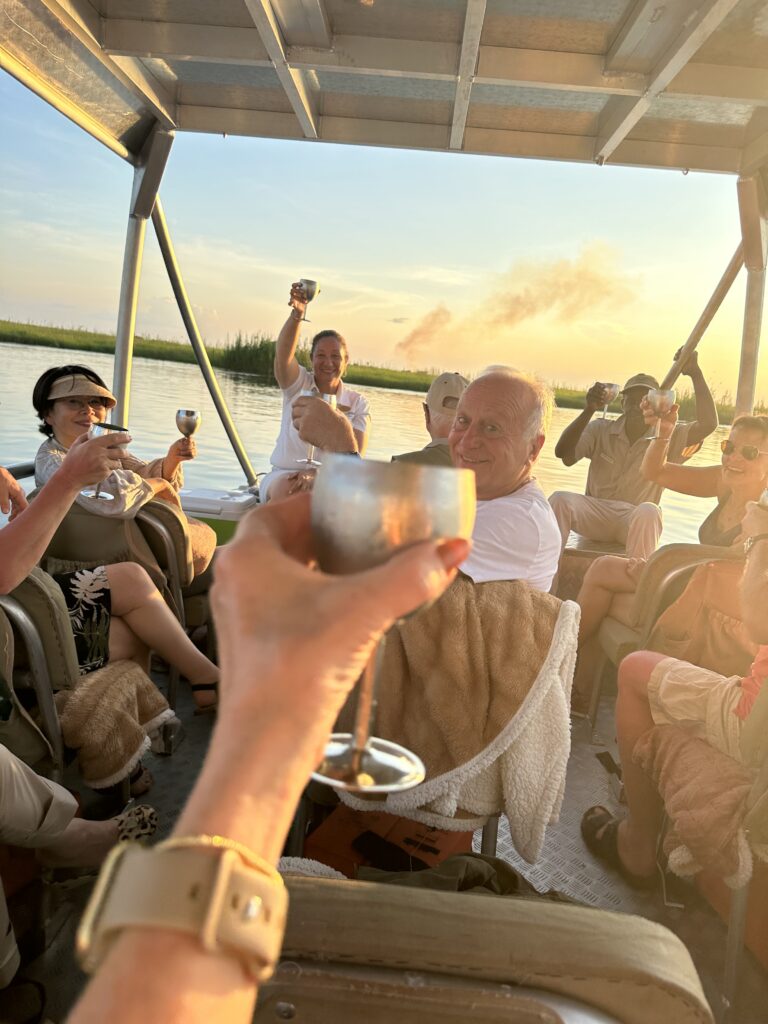 Sunset, champagne on boat in Africa