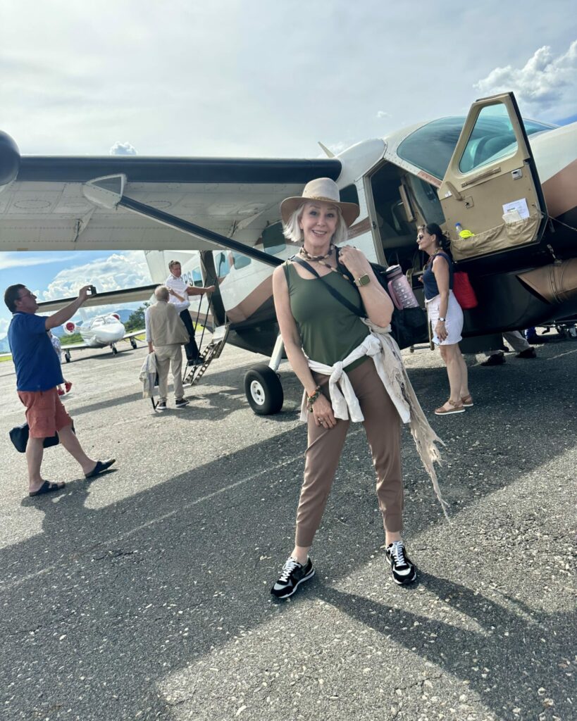 Sheree Frede standing in front of Cessna Caravan aircraft