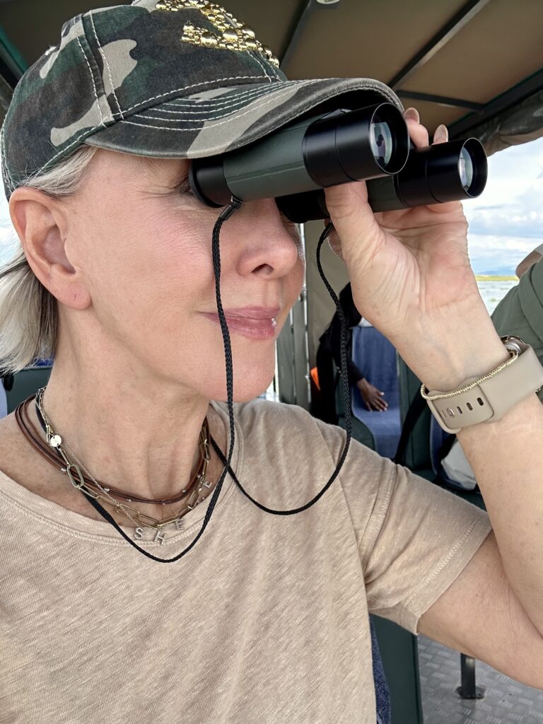 Sheree Frede looking through binoculars