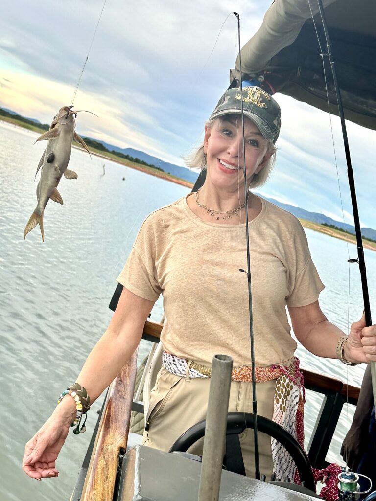 Sheree Frede with her catfish she caught on the little boat