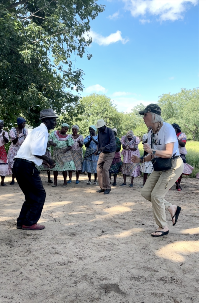 Sheree Frede dancing with a IMPALILA Dancer