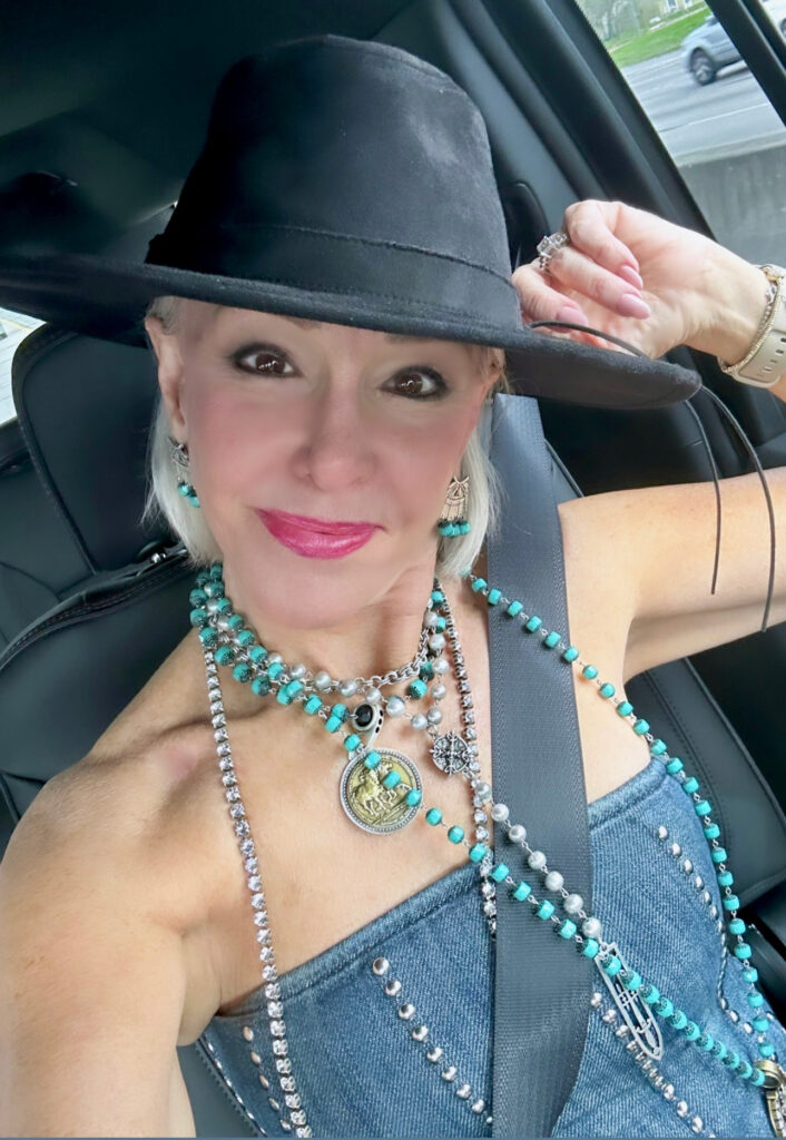 Sheree Frede wearing layered necklaces, hat and denim bustier