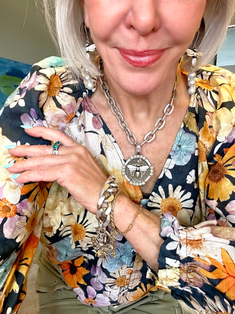 Sheree Frede wearing French Kande Jewelry dressed in a floral top