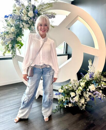Sheree Frede wearing blue denim cargo pants with dressy white top