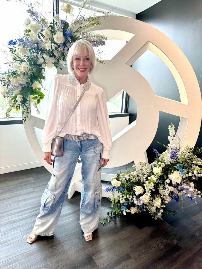 Sheree Frede wearing blue denim cargo pants with dressy white top