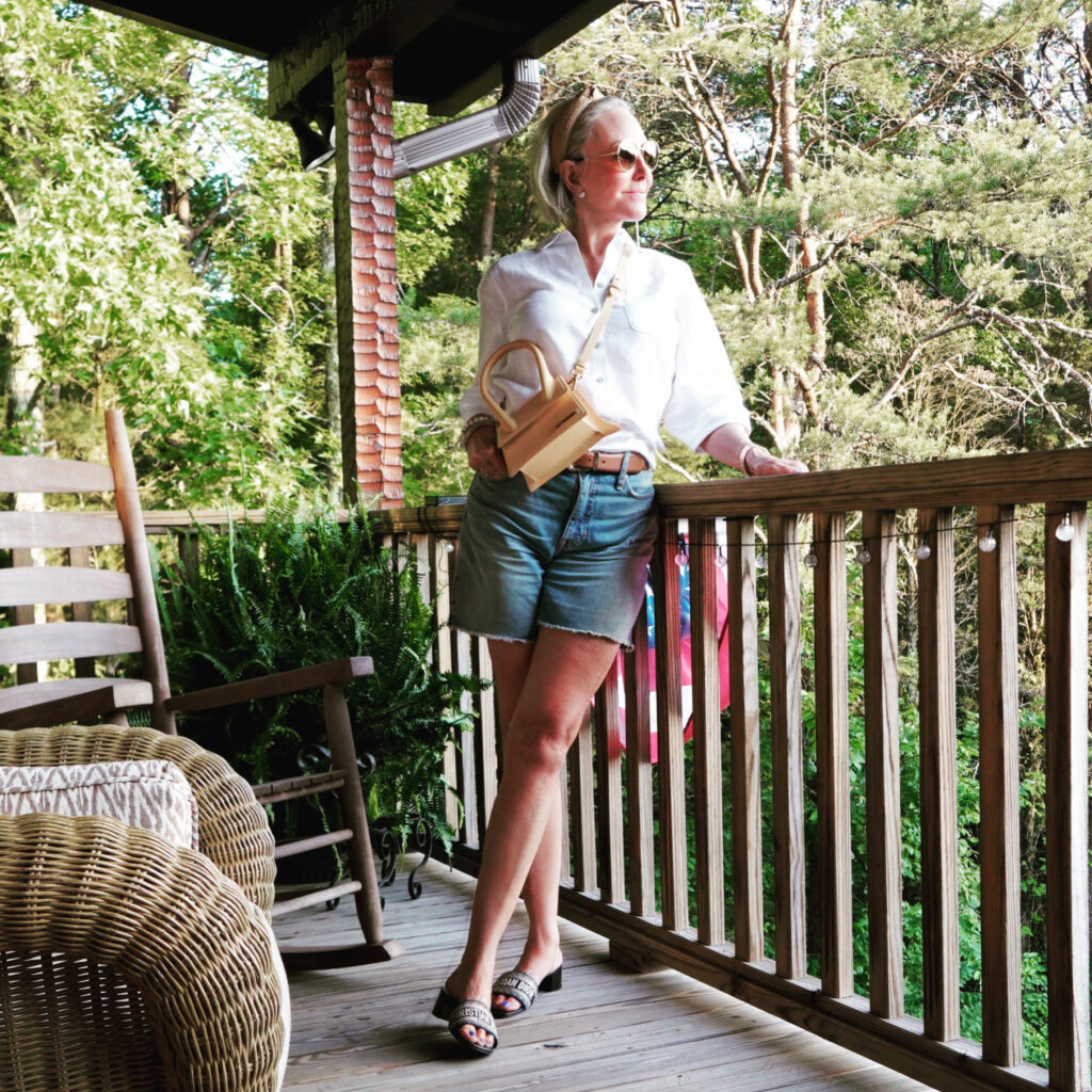 Sheree Frede wearing a white linen shirt and denim shorts
