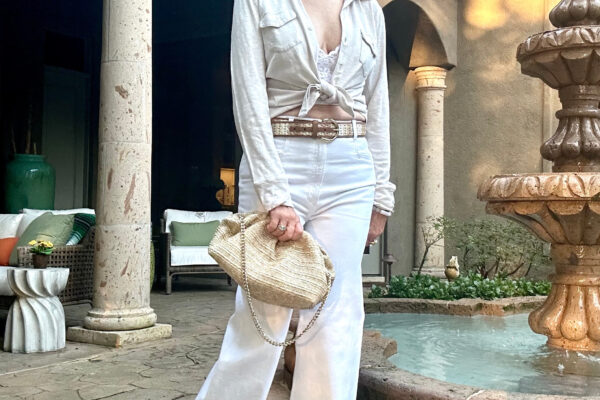 Sheree Frede wearing white wide leg jeans and off white camp shirt and crochet bucket hat