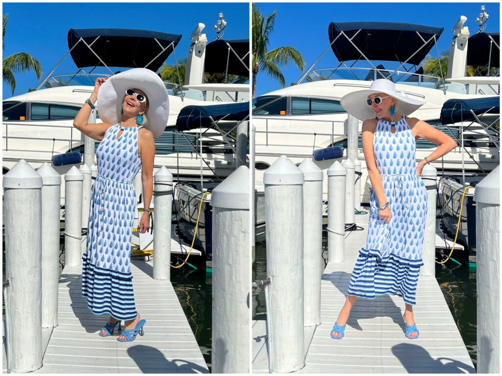 Sheree Frede of the SheShe Show wearing a Cabana Life blue and white maxi sundress, floppy white straw hat, sunglasses and blue earrings for a patriotic Memorial Day or July 4th attire.