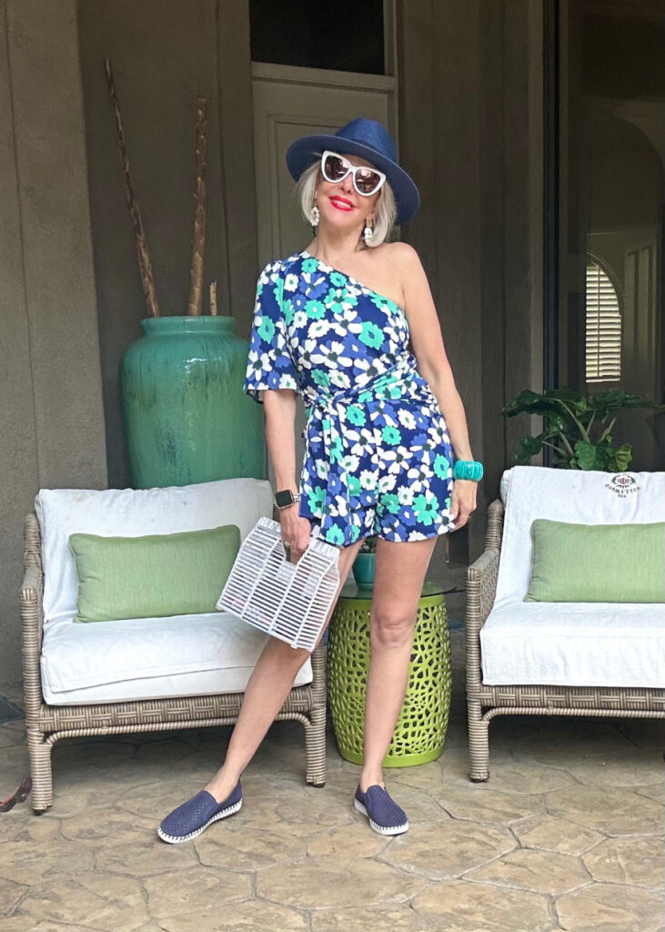 Sheree Frede wearing a floral romper with white summer handbag