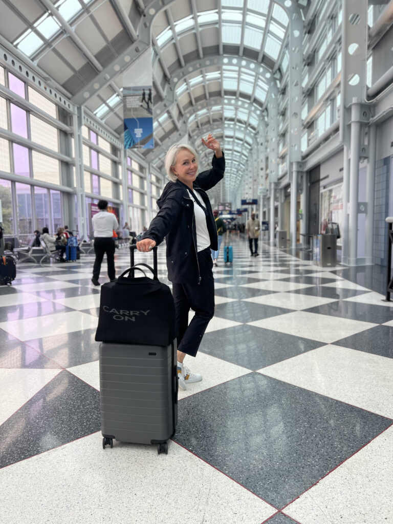 Sheree Frede pulling rollon bag in airport