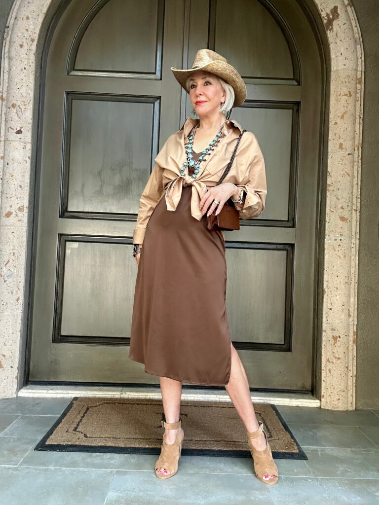 Sheree Frede wearing classic button down shirt over a brown satin slip dress