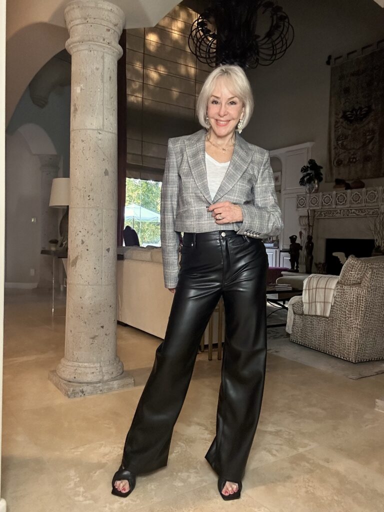 Sheree wearong a crop plaid blazer over black faux leather wide leg pants