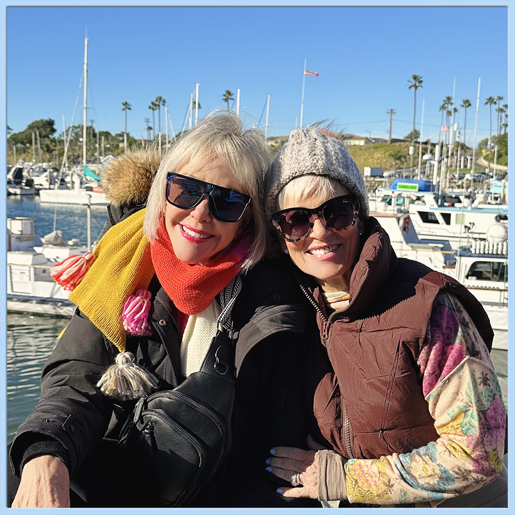 Sheree Frede and Shauna sitting on the dock at Oceanside Harbor Marina