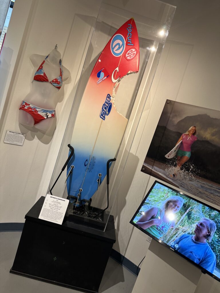 Bethany Hamilton's shark bitten surf board and her swimsuit that she was wearing when she lost her arm.