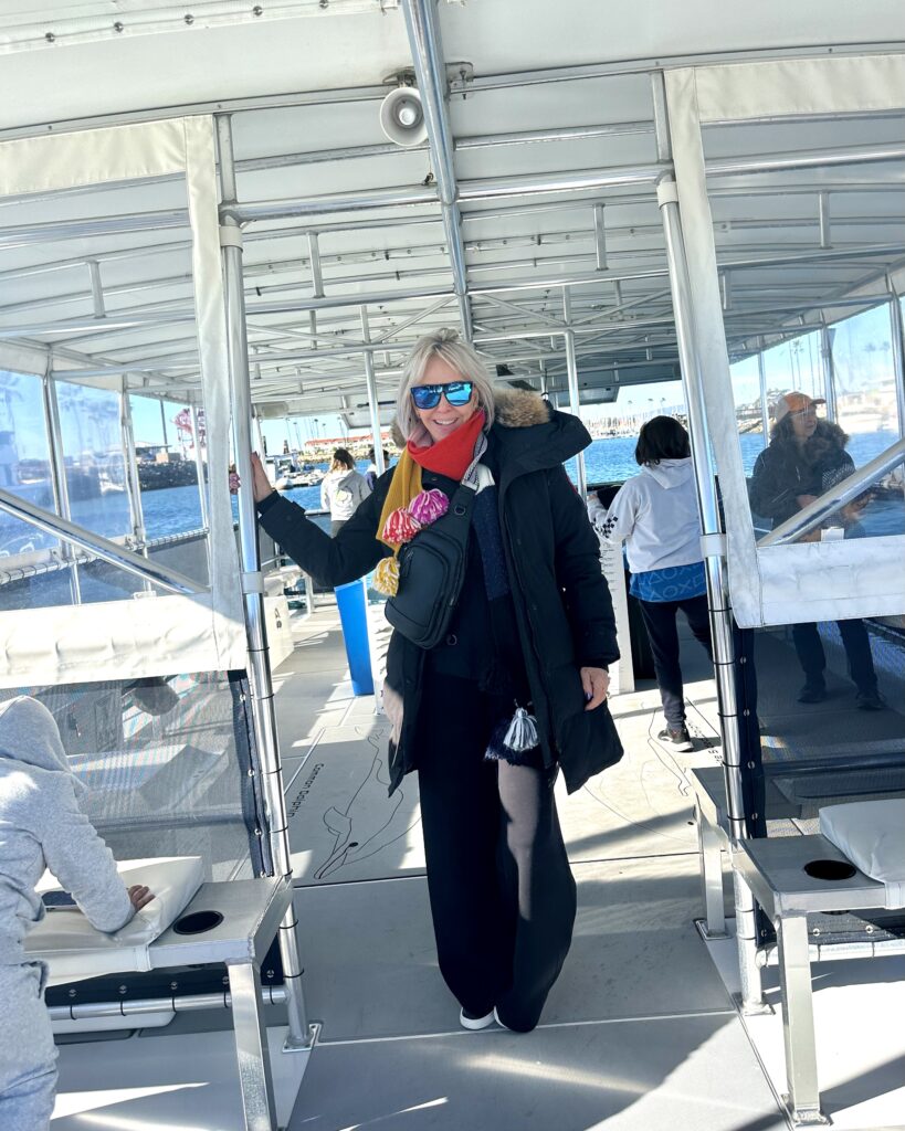 Sheree Frede on a boat enjoying a whale watching tour