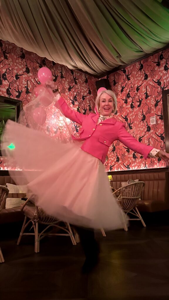 Sheree Frede wearing a pink tulle skirt and hot pink tweed jacket