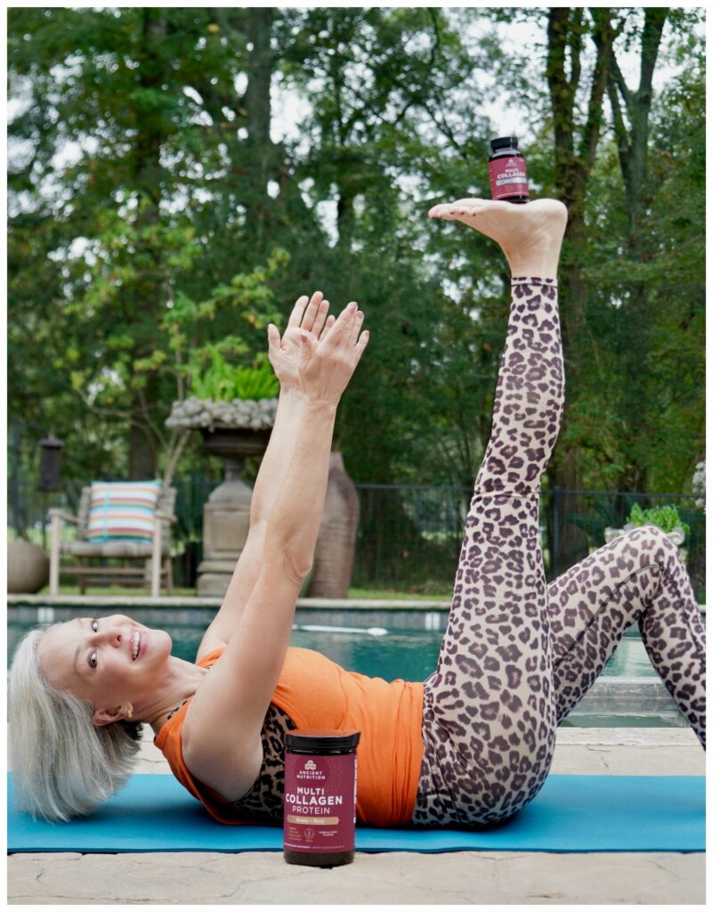 Sheree stretching by the pool with her Ancient Nutrition Collagen products