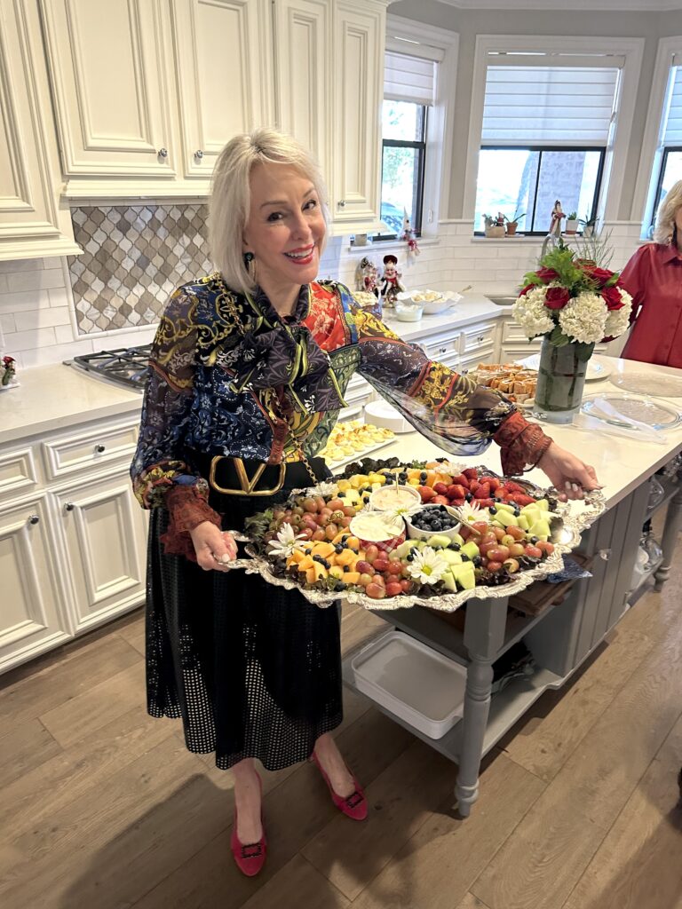 Sheree holding a healthy charcuterie board