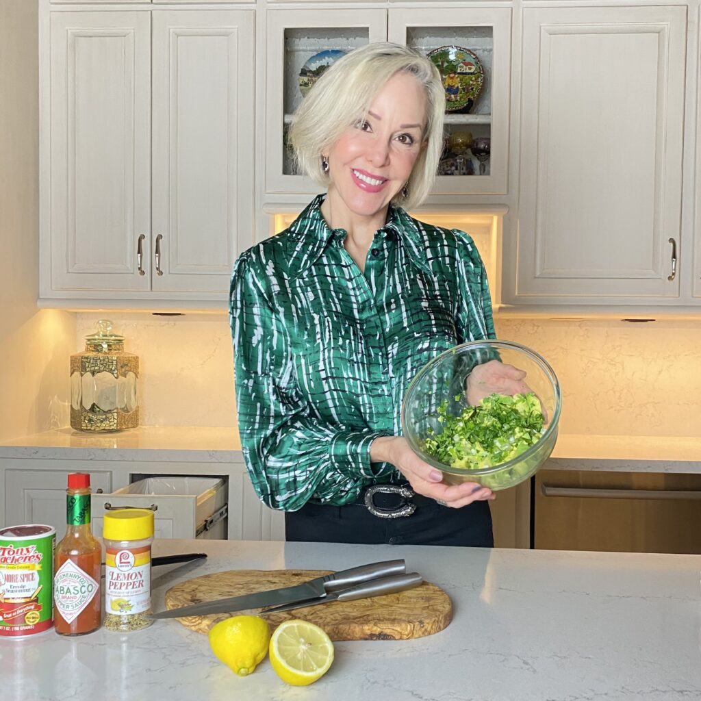 Sheree holding a bowl of homemade quacamole