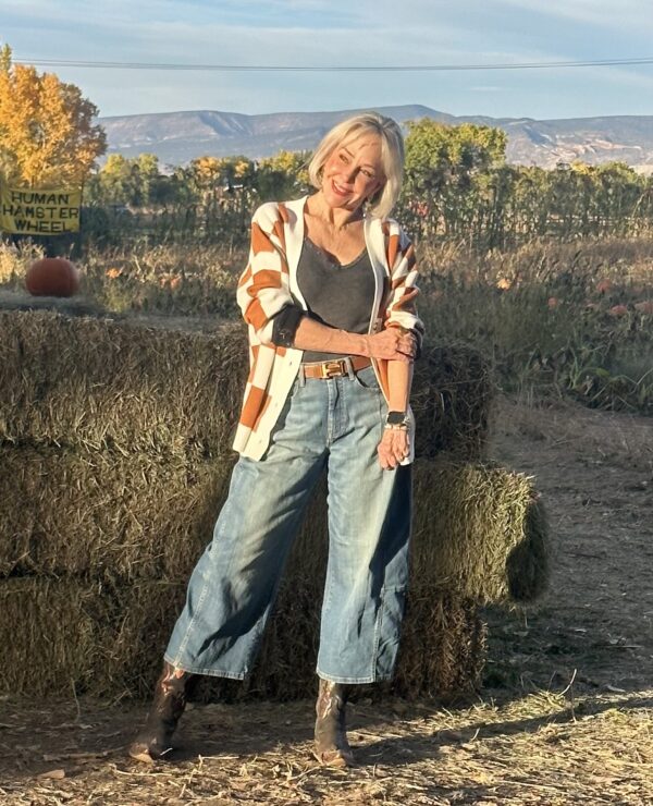 Checkered chic and on trend orange and white sweater and wide leg jeans