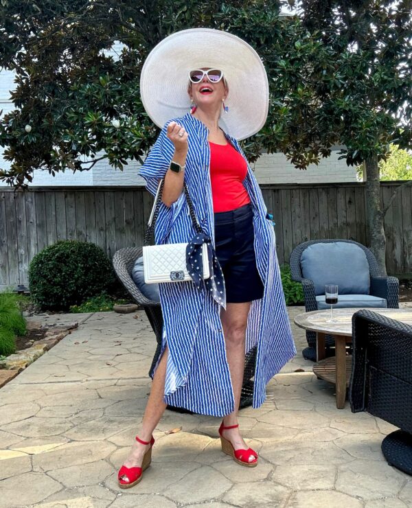 4th of july coat, red sando, black shorts, white hat, red sandals, white bag